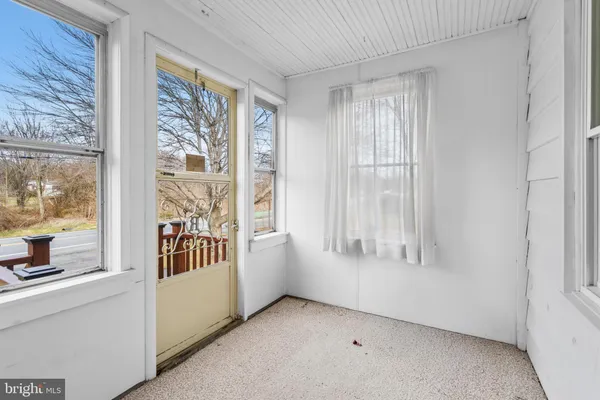 a view of a room with a large window