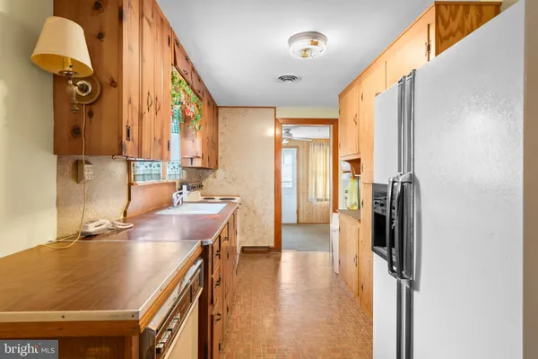 a bathroom with a sink a mirror and a shower