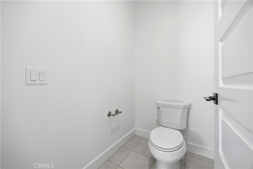20138 Marlow Lane Porter Ranch, CA 91326 - Photo 25 of 39 a white toilet sitting next to a white wall