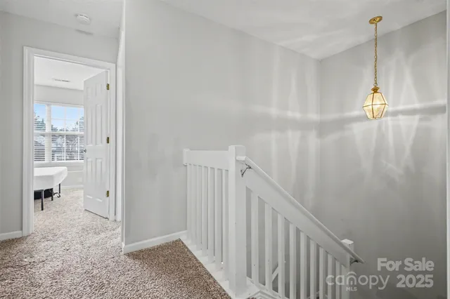 a view of a hallway view with staircase