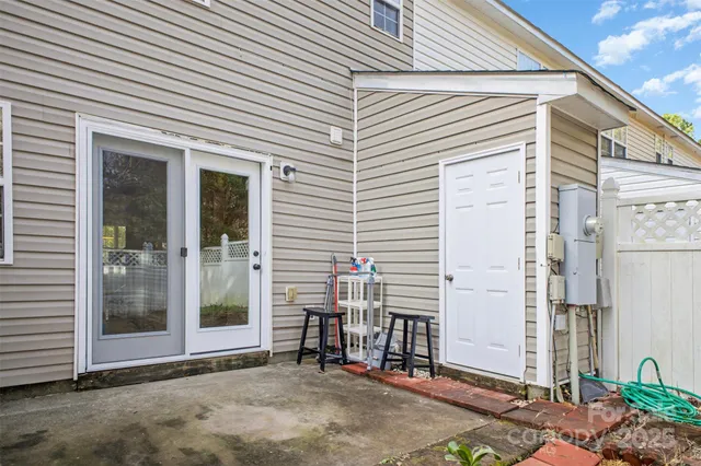 a view of backyard with seating space