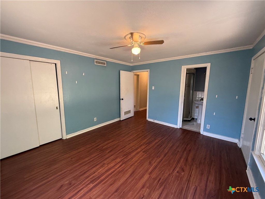 1701 North 13th Street Temple, TX 76501 - Photo 17 of 48 wooden floor in an empty room with a window