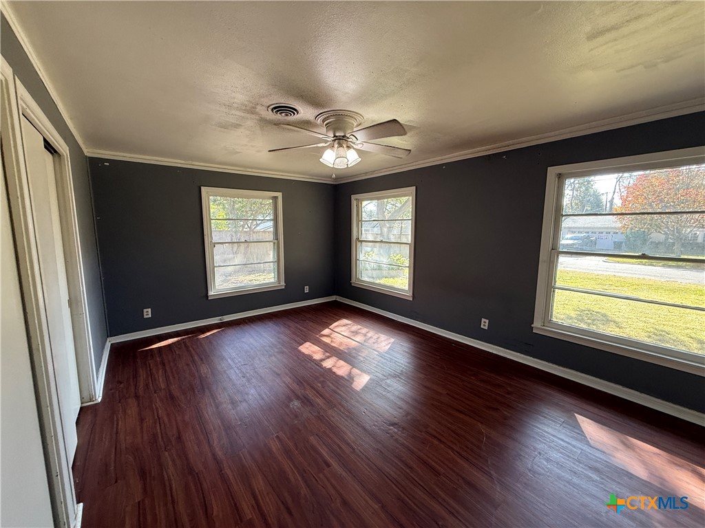 1701 North 13th Street Temple, TX 76501 - Photo 22 of 48 a view of an empty room with wooden floor and a window