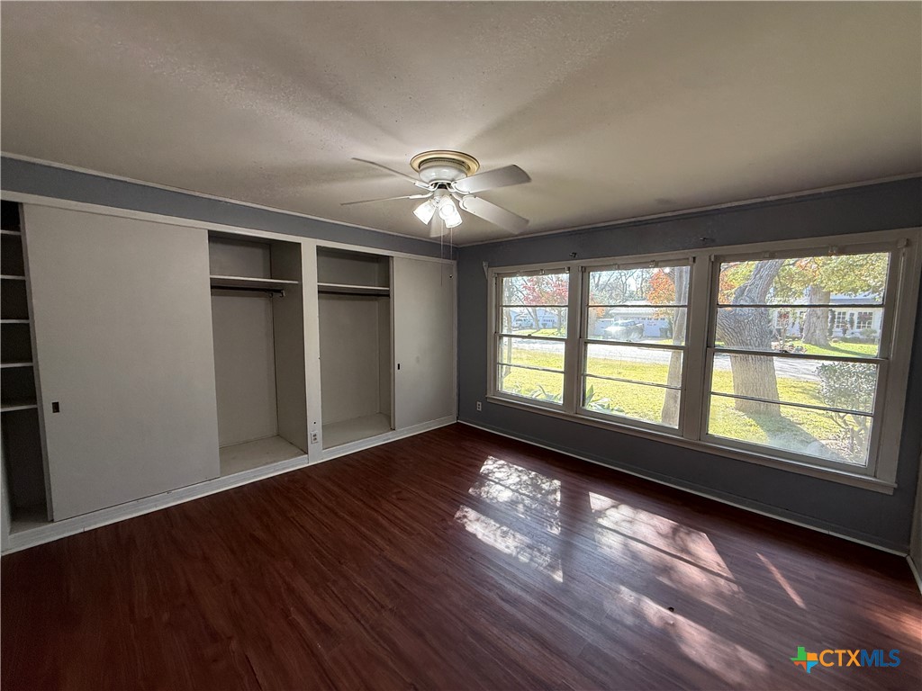 1701 North 13th Street Temple, TX 76501 - Photo 29 of 48 wooden floor in an empty room with a window