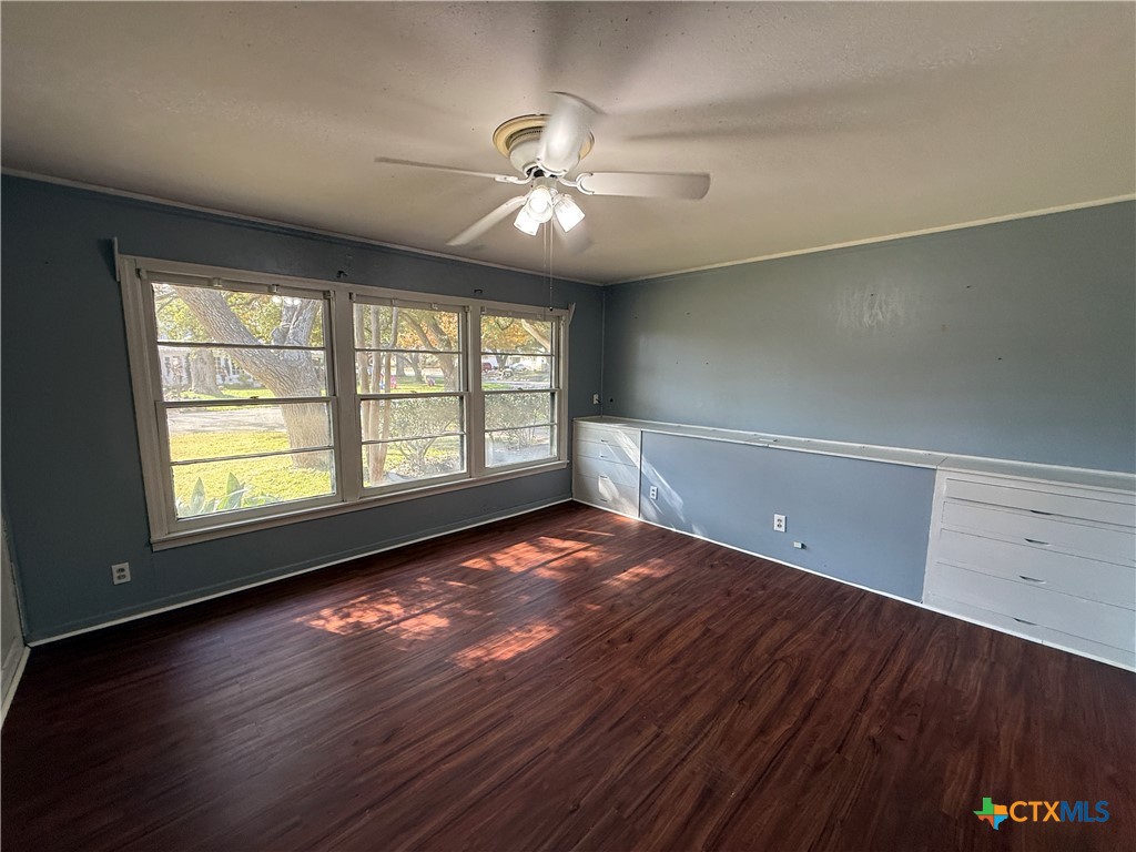 1701 North 13th Street Temple, TX 76501 - Photo 32 of 48 a view of an empty room with wooden floor and a window