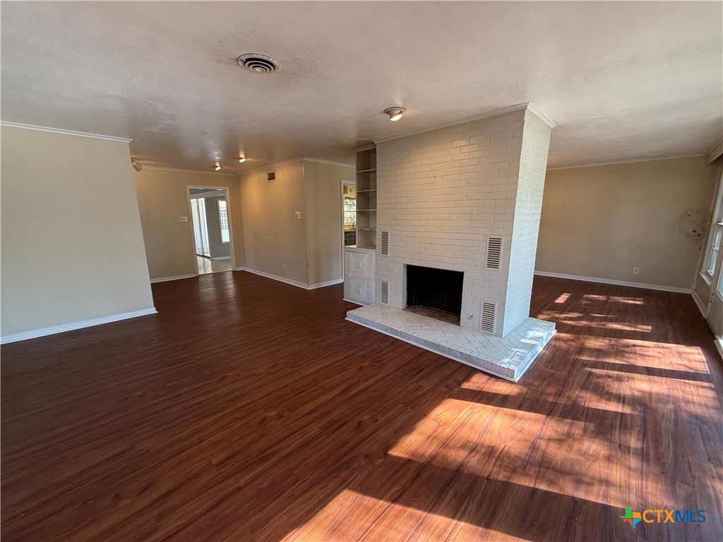 1701 North 13th Street Temple, TX 76501 - Photo 9 of 48 a view of a livingroom with a fireplace