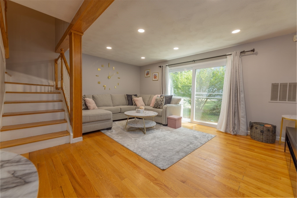 a living room with furniture and a table