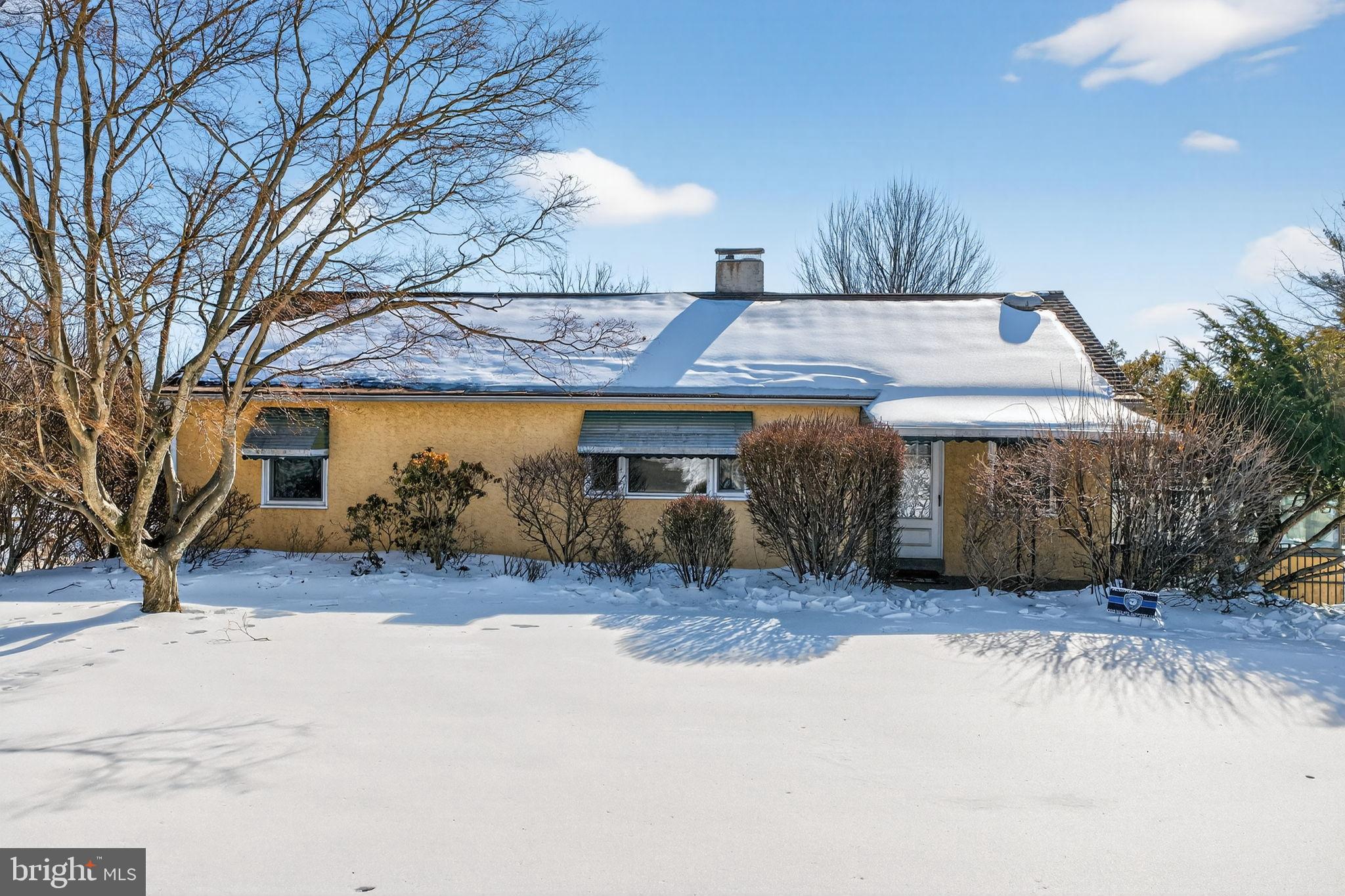 Charming home blanketed in winter's embrace.