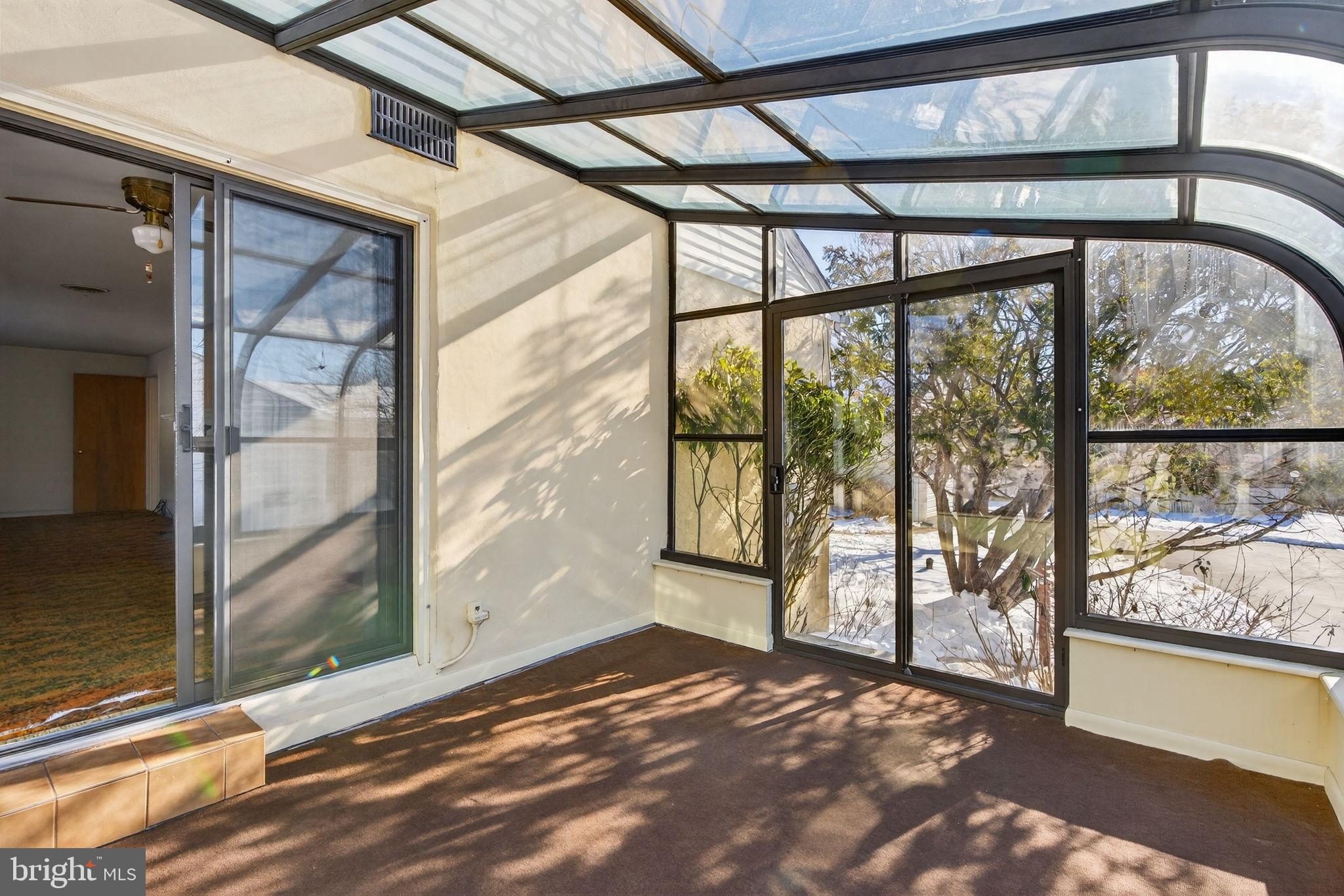 2016 North Trooper Road Norristown, PA 19403 - Photo 14 of 53 Sunlit sunroom with expansive glass views.