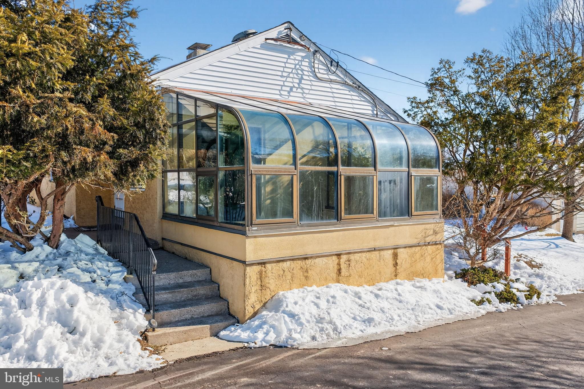2016 North Trooper Road Norristown, PA 19403 - Photo 5 of 53 Charming sunroom nestled in winter's embrace.
