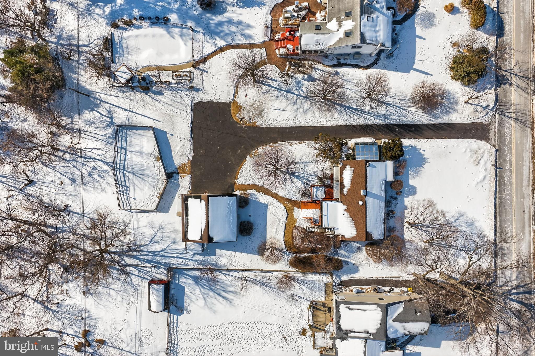 2016 North Trooper Road Norristown, PA 19403 - Photo 52 of 53 Snow-covered homes in a serene winter landscape.