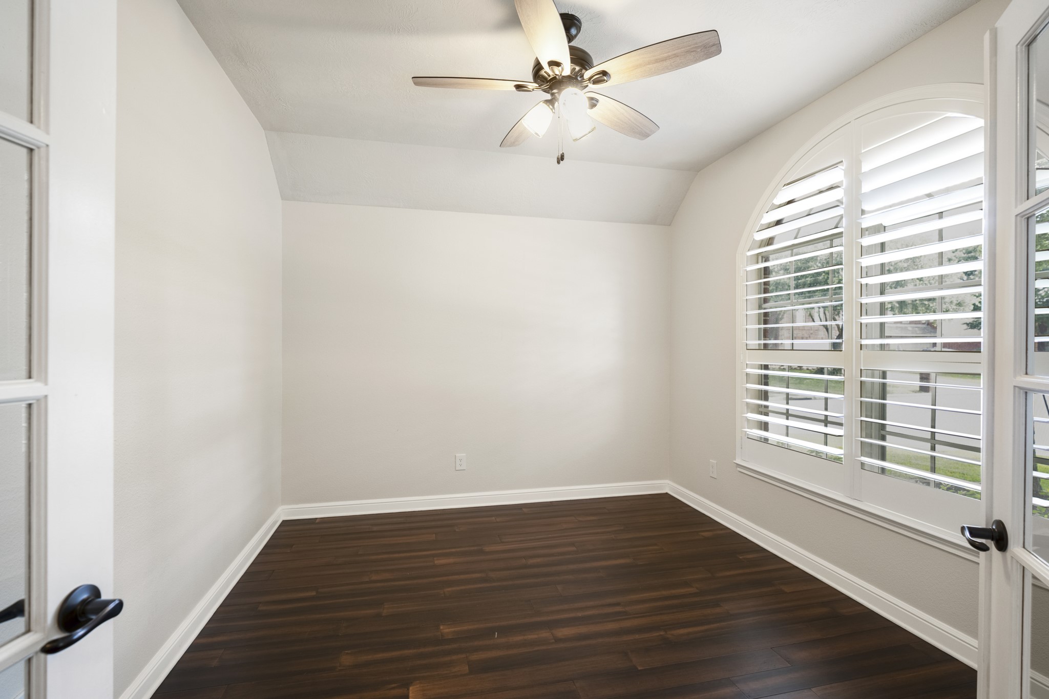 5802 Sawyer Bend Lane Spring, TX 77379 - Photo 5 of 50 a view of an empty room with wooden floor and a window
