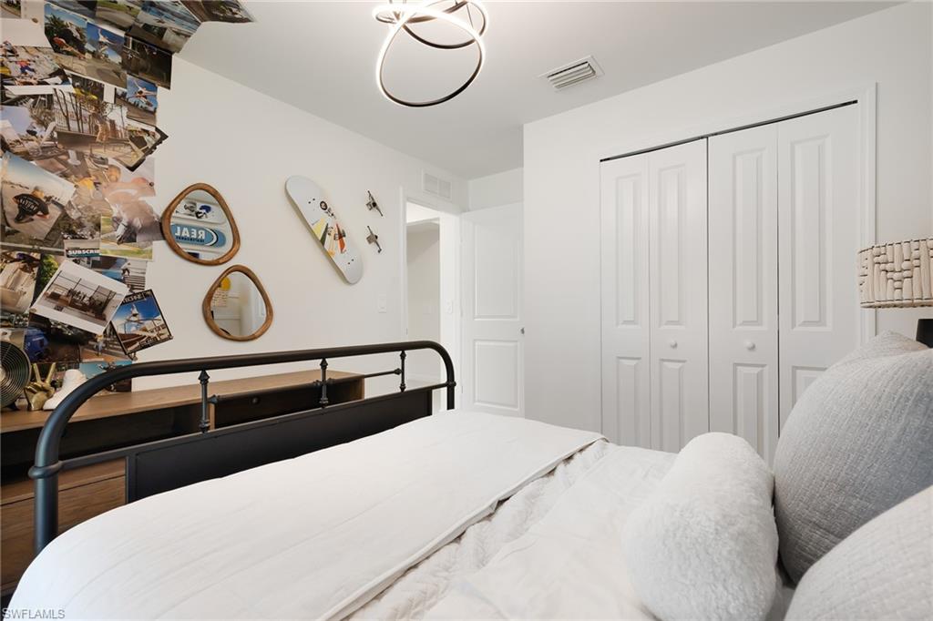 3717 40th Street Southwest Lehigh Acres, FL 33976 - Photo 17 of 30 a bedroom with a bed and a window