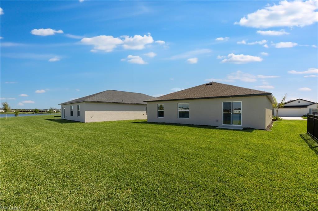 3717 40th Street Southwest Lehigh Acres, FL 33976 - Photo 28 of 30 a house view with a garden space