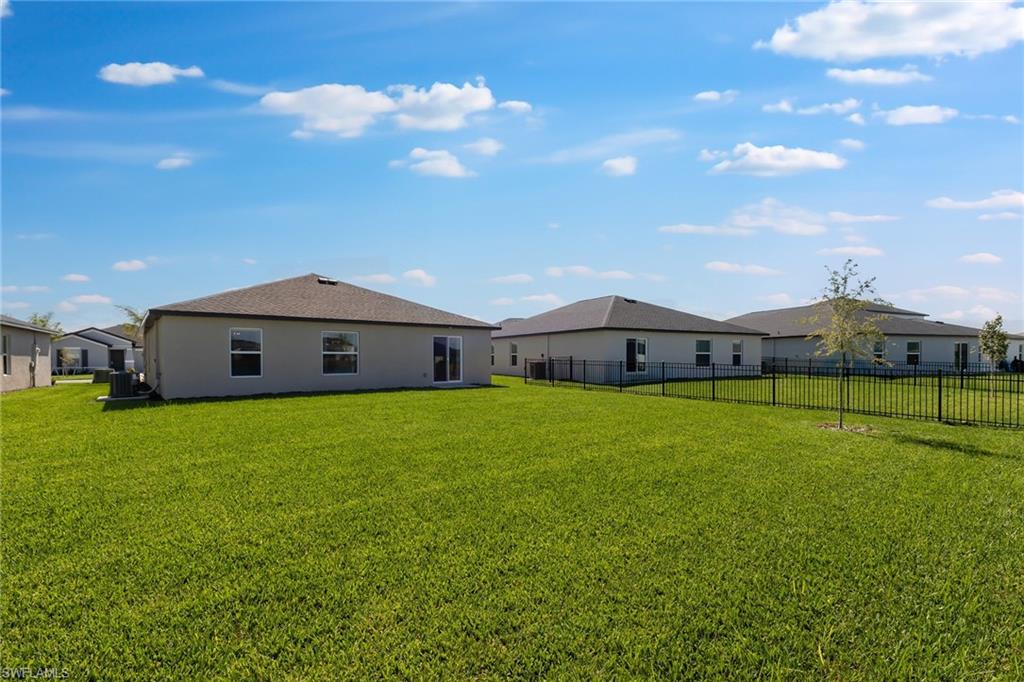 3717 40th Street Southwest Lehigh Acres, FL 33976 - Photo 30 of 30 a view of a house with a big yard
