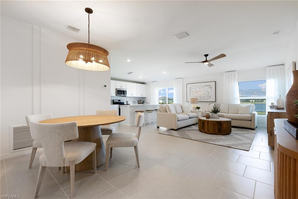 3717 40th Street Southwest Lehigh Acres, FL 33976 - Photo 10 of 30 a view of a dining room with furniture