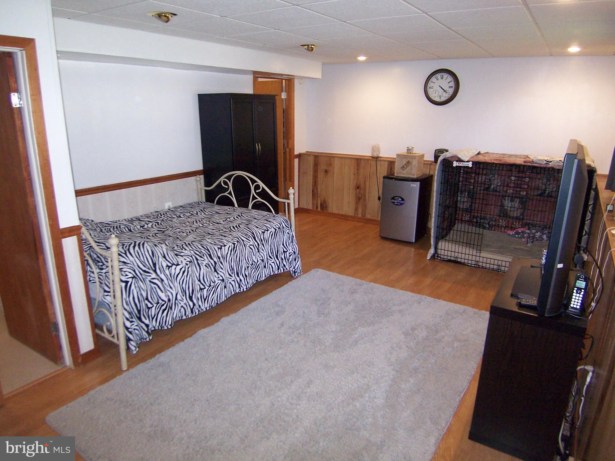 18 Yew Road Baltimore, MD 21221 - Photo 12 of 30 a bedroom with furniture and natural light