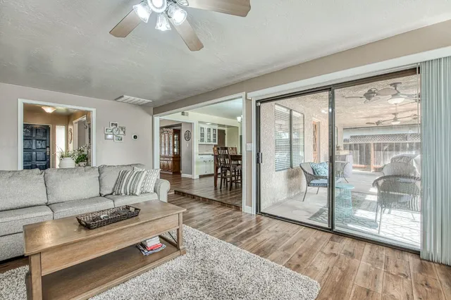 a view of a dining room with furniture wooden floor and chandelier