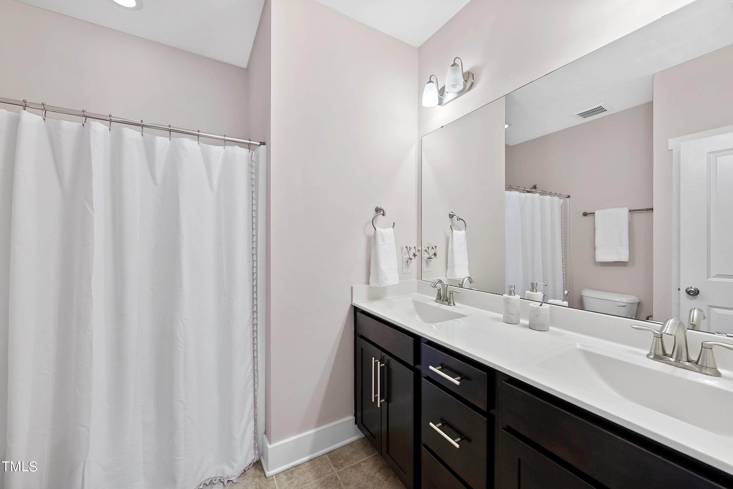 5205 Beckom Street Raleigh, NC 27616 - Photo 28 of 37 Second floor full bath attached to third bedroom