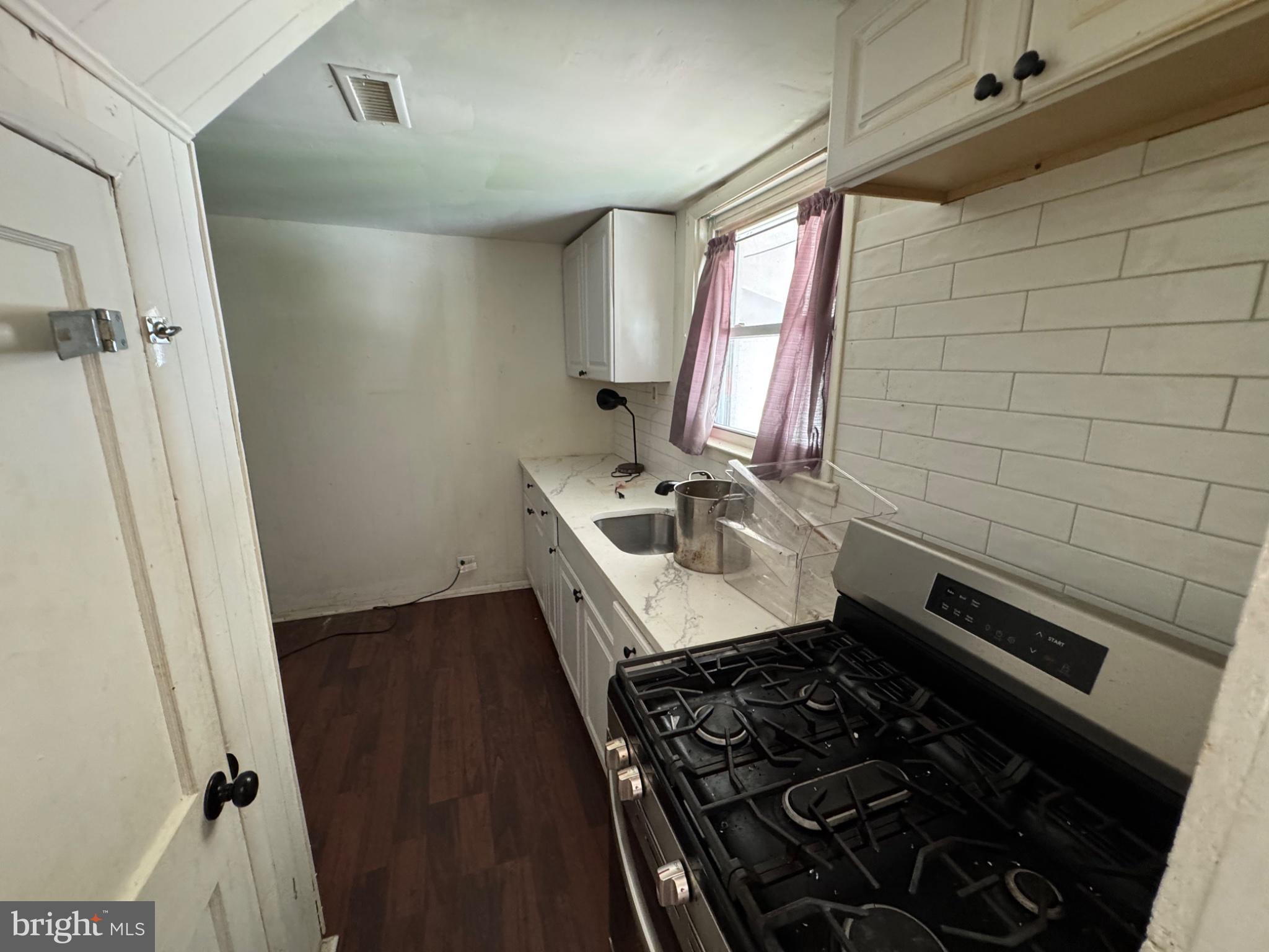2606 Smithers Street Chester, PA 19013 - Photo 3 of 6 Cozy kitchen with modern charm.