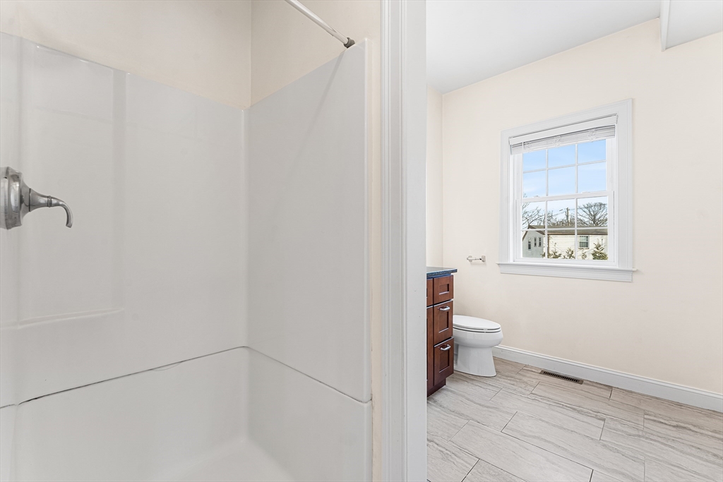 2 Mechanic Street, Unit 1 Medway, MA 02053 - Photo 11 of 32 a bathroom with a toilet