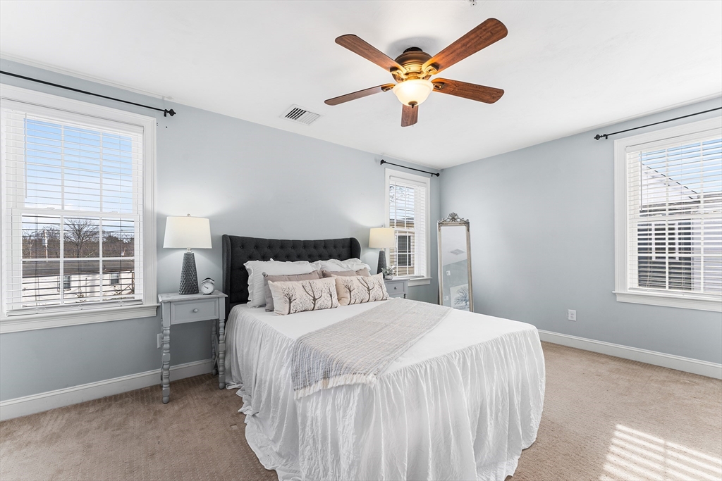 2 Mechanic Street, Unit 1 Medway, MA 02053 - Photo 14 of 32 a bedroom with a large bed and a window