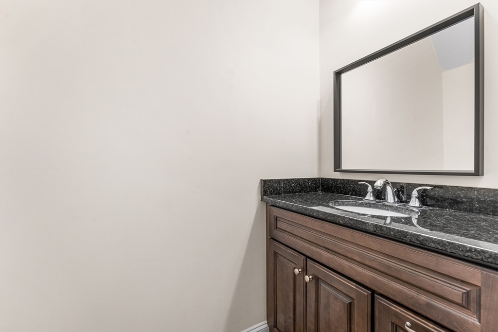 2 Mechanic Street, Unit 1 Medway, MA 02053 - Photo 25 of 32 a bathroom with a sink and a mirror