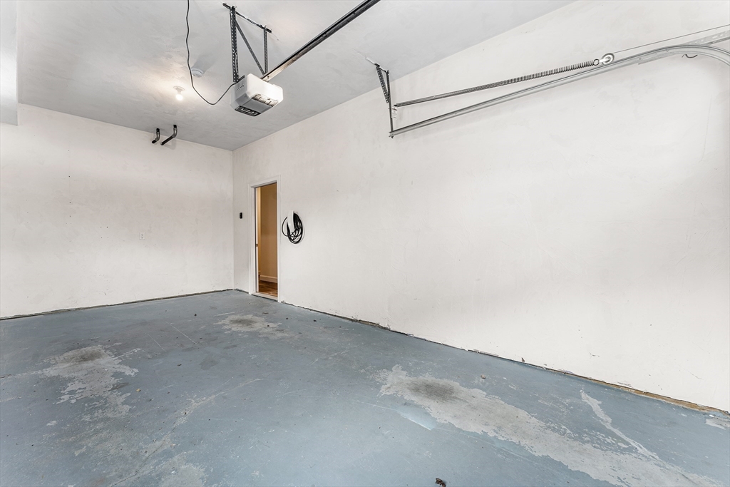 2 Mechanic Street, Unit 1 Medway, MA 02053 - Photo 27 of 32 a view of a room with a chandelier fan