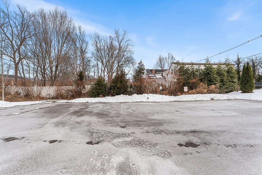 2 Mechanic Street, Unit 1 Medway, MA 02053 - Photo 31 of 32 a view of large space covered with snow in front of house