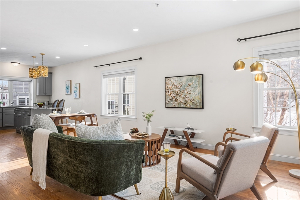 2 Mechanic Street, Unit 1 Medway, MA 02053 - Photo 8 of 32 a living room with furniture and a large window