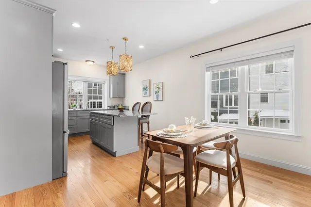 a kitchen with a table and chairs in it