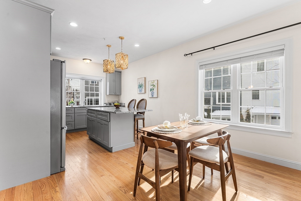 2 Mechanic Street, Unit 1 Medway, MA 02053 - Photo 9 of 32 a kitchen with a table and chairs in it
