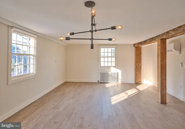 a kitchen with kitchen island a sink appliances and cabinets