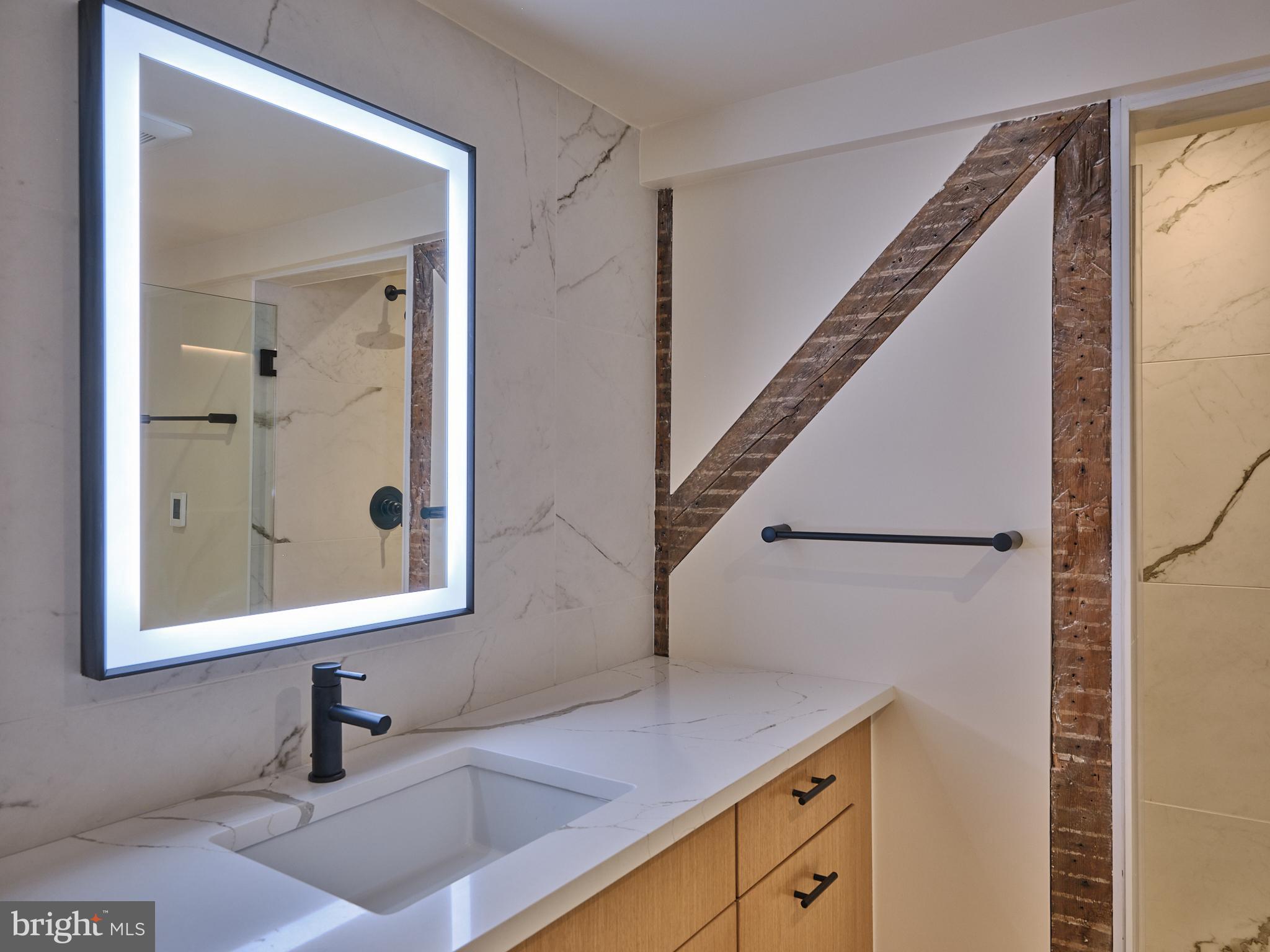 44 South Main Street, Unit 2N New Hope, PA 18938 - Photo 6 of 23 a bathroom with a sink and a mirror