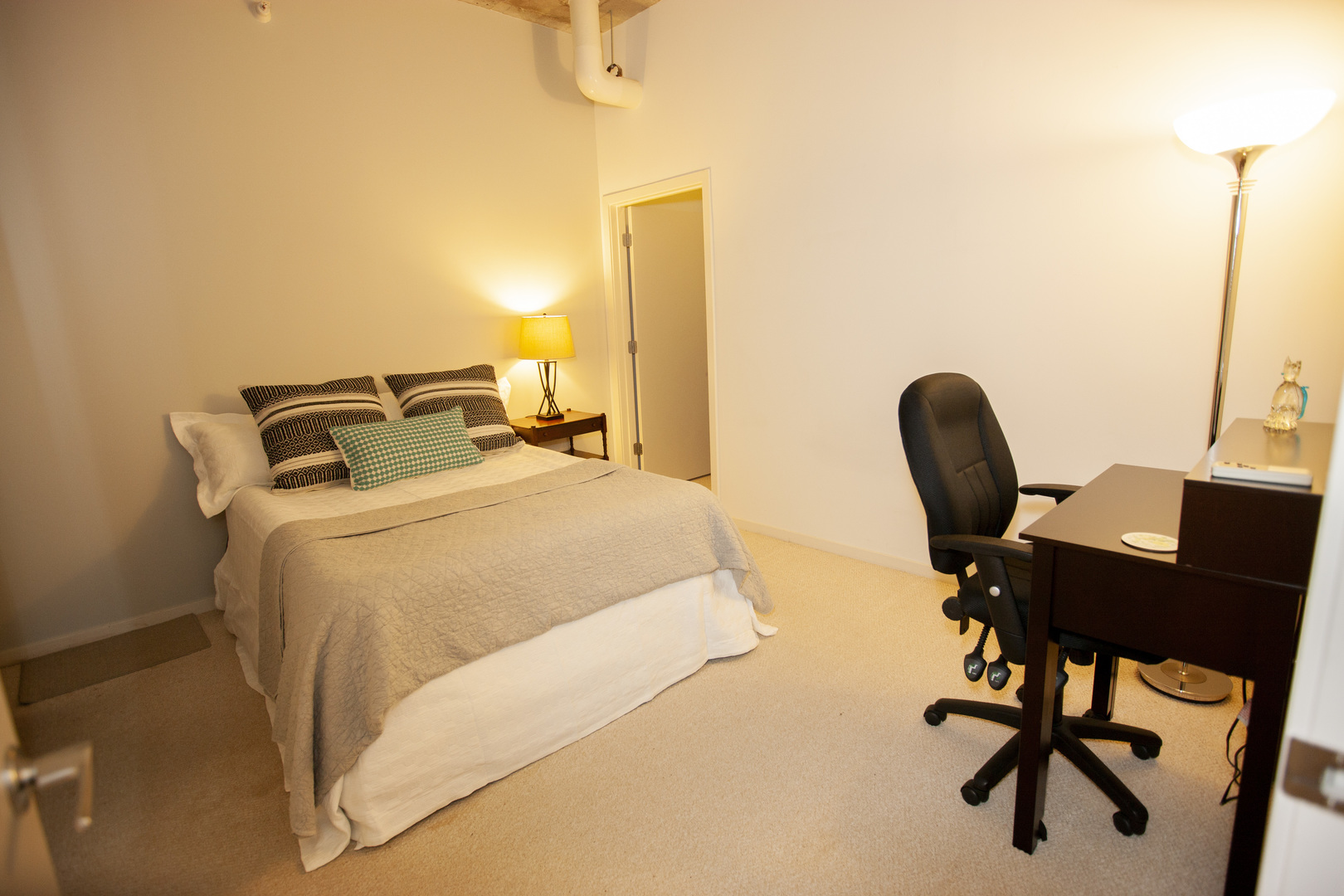 807 Davis Street, Unit 505 Evanston, IL 60201 - Photo 12 of 17 a bedroom with a bed and a desk