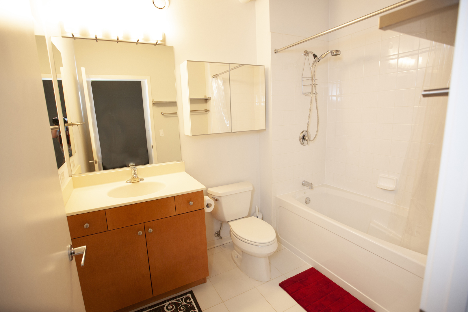807 Davis Street, Unit 505 Evanston, IL 60201 - Photo 14 of 17 a bathroom with a sink a toilet and shower