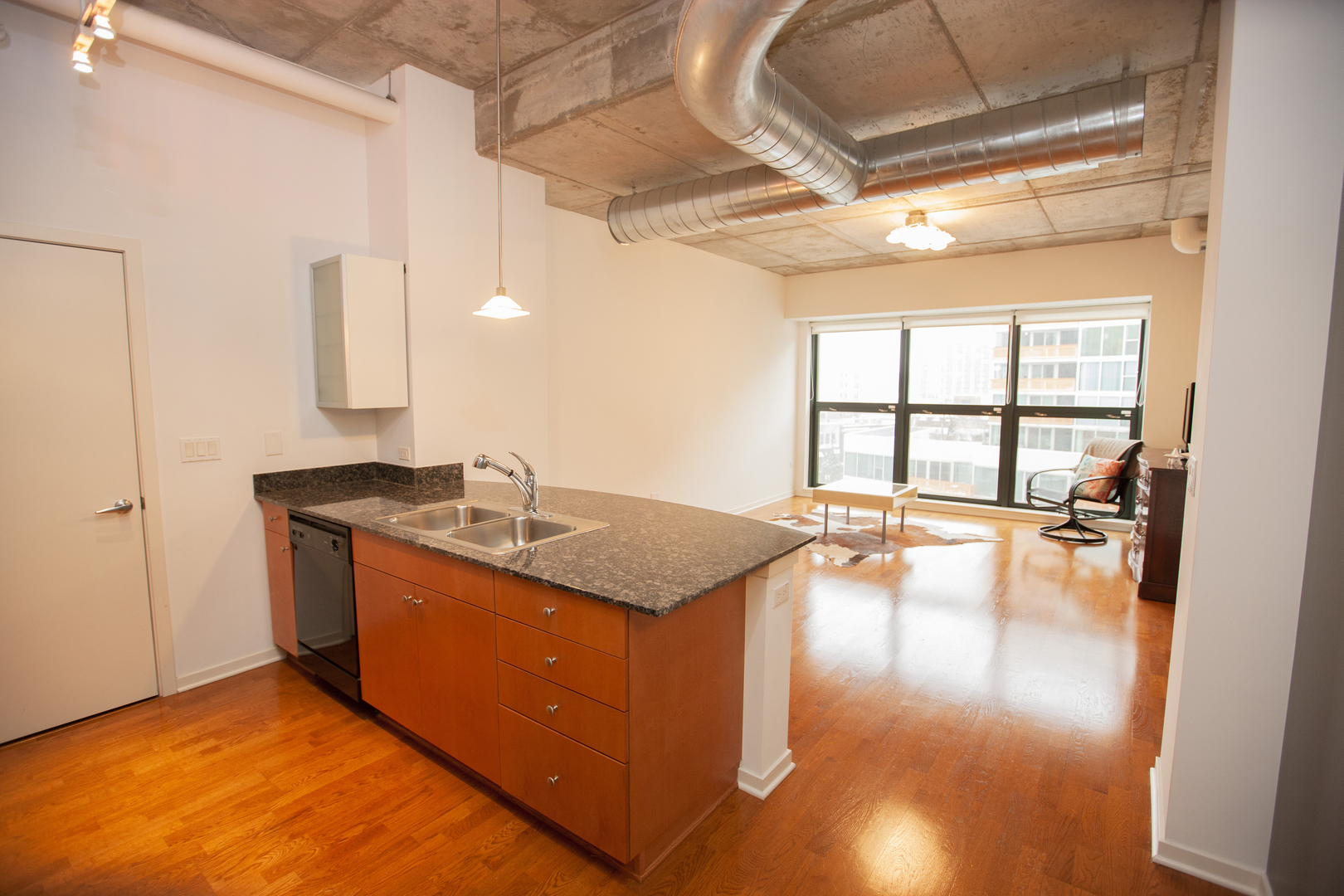 807 Davis Street, Unit 505 Evanston, IL 60201 - Photo 8 of 17 a kitchen with sink and cabinets