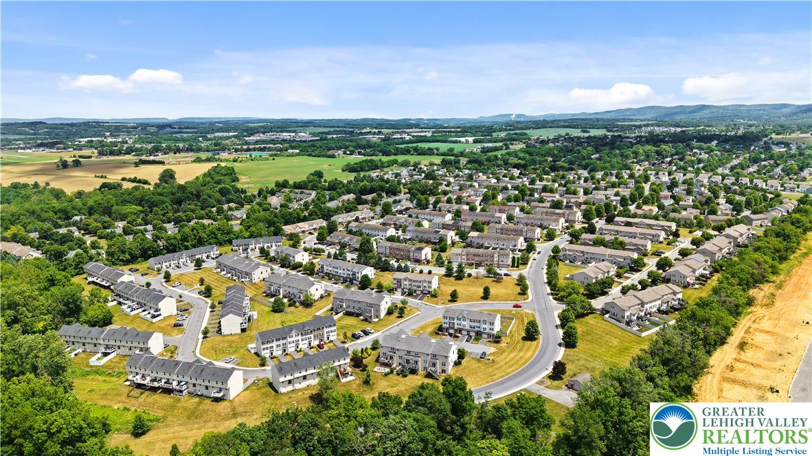 2336 Alex Road Easton, PA 18040 - Photo 31 of 35 An aerial perspective reveals a vast community of townhomes nestled amongst lush green landscapes.