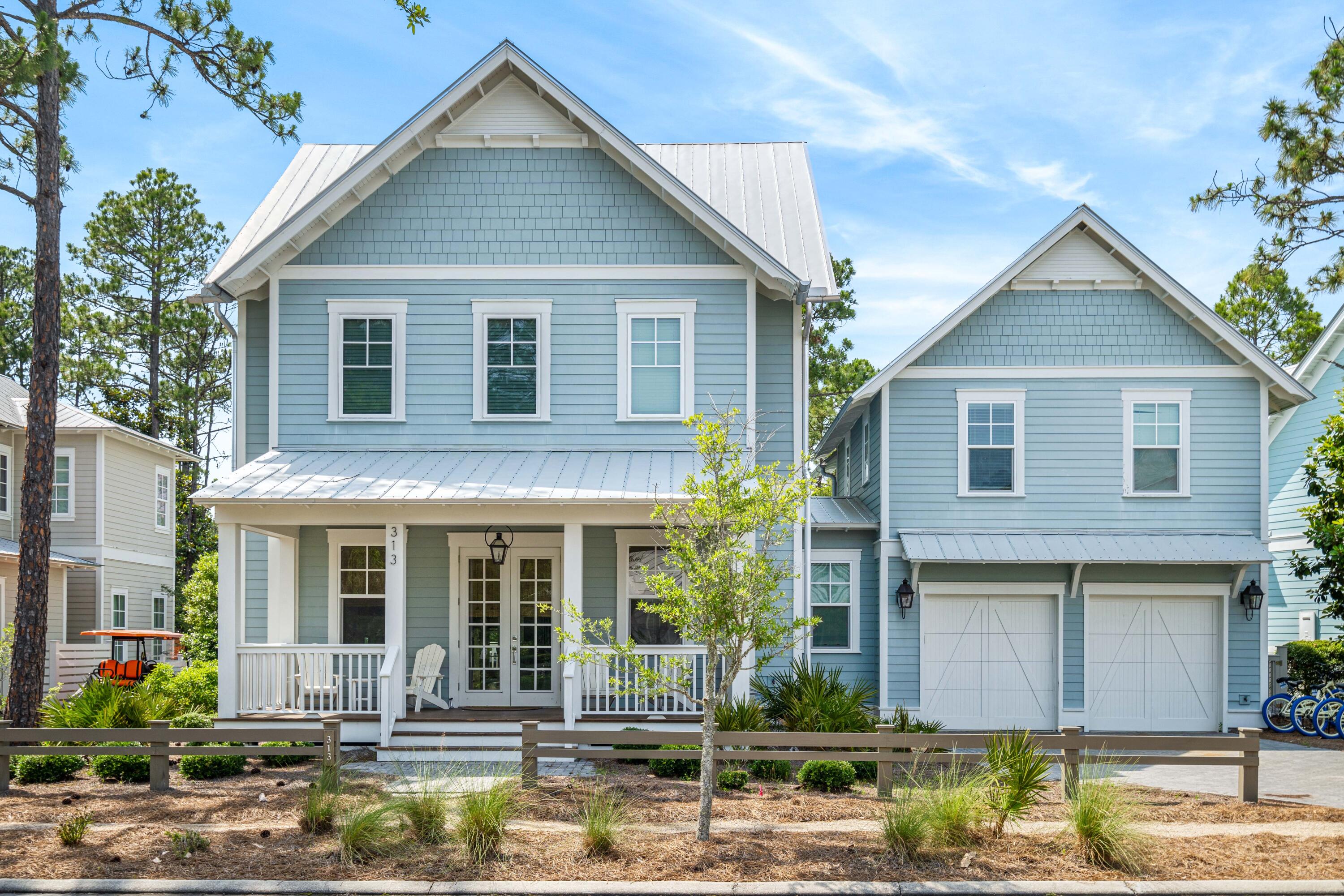a front view of a house with garden