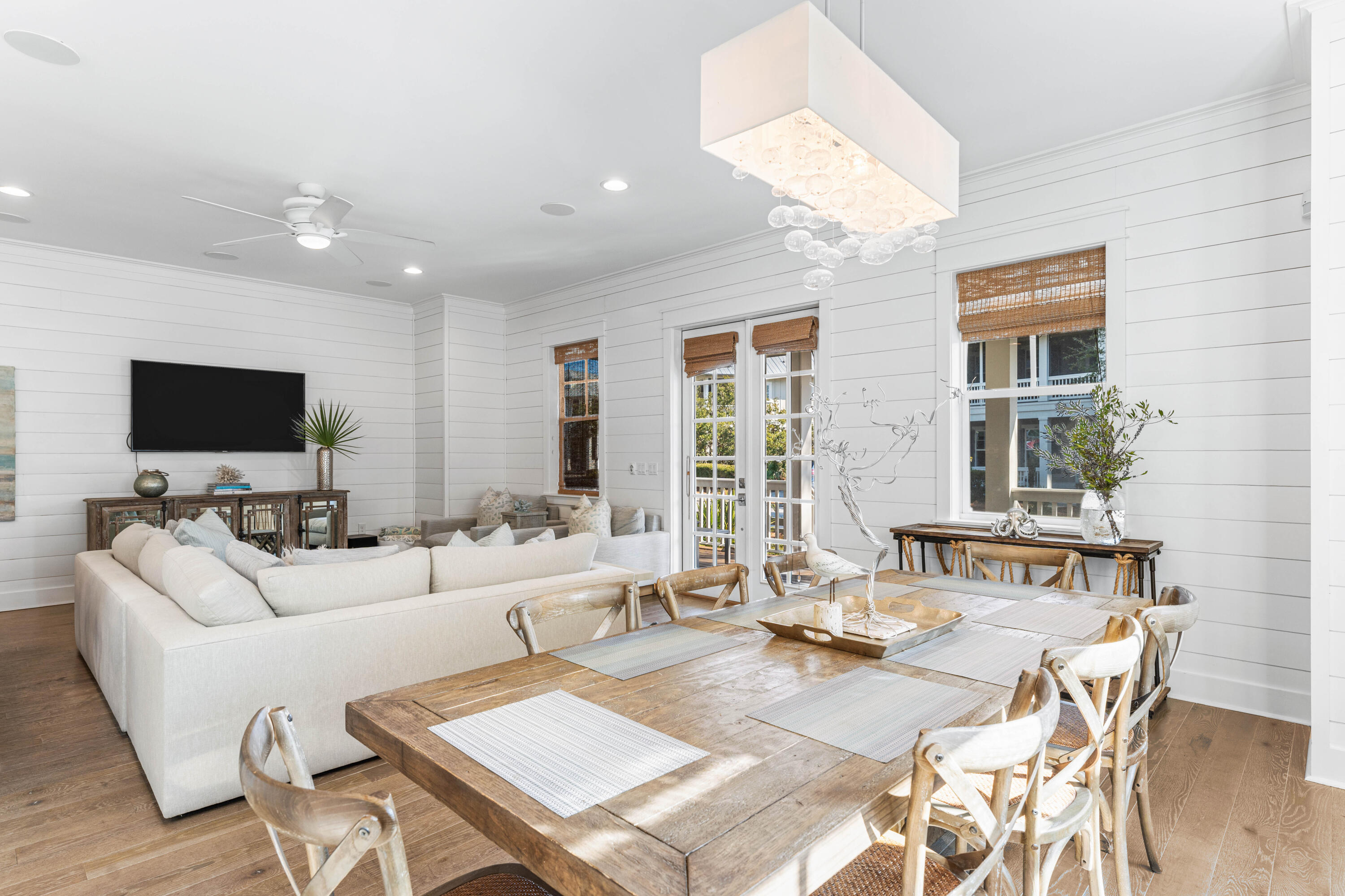 313 East Royal Fern Way Santa Rosa Beach, FL 32459 - Photo 11 of 48 a living room with furniture a flat screen tv and a large window