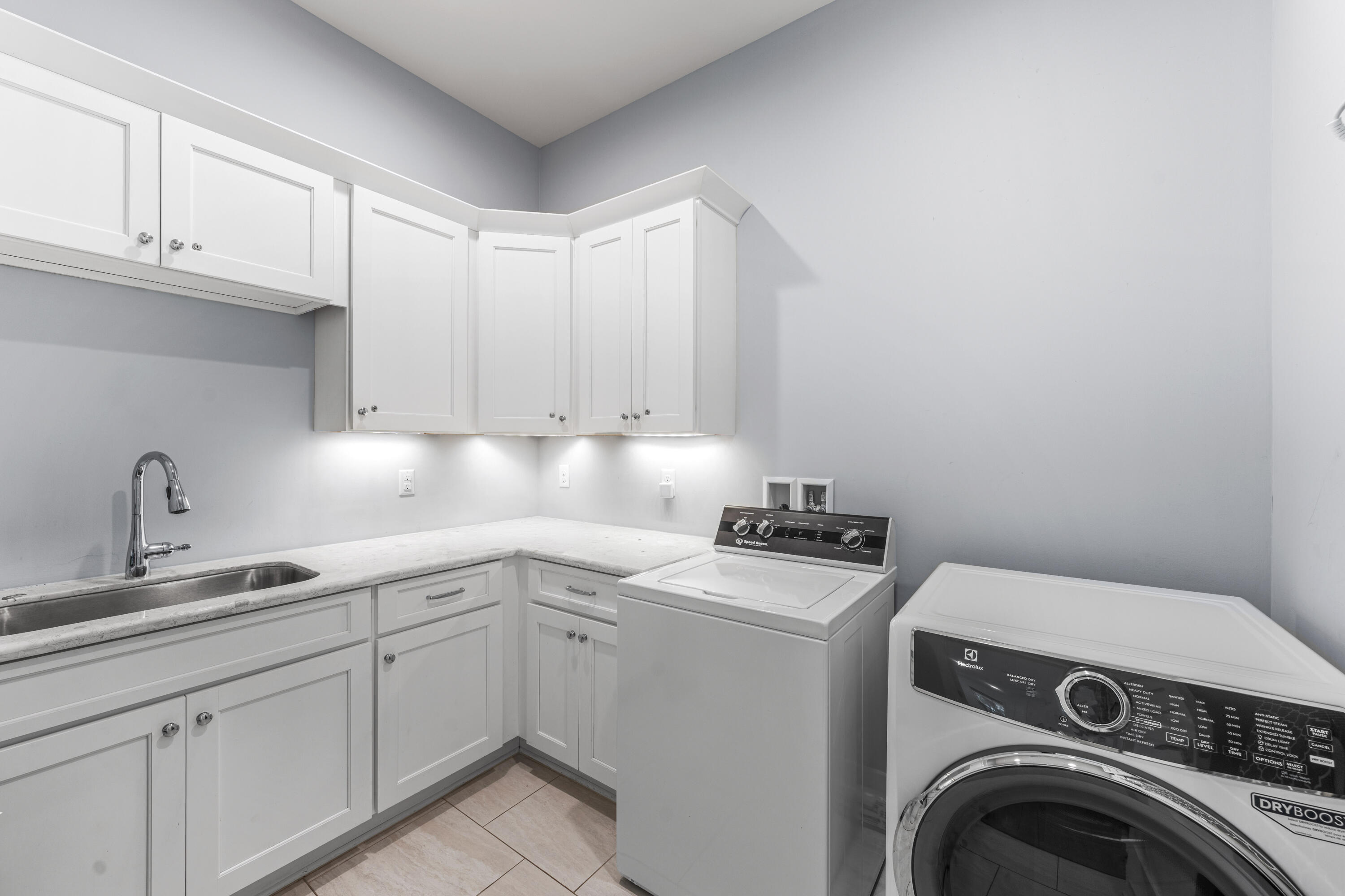 313 East Royal Fern Way Santa Rosa Beach, FL 32459 - Photo 17 of 48 a utility room with sink dryer and washer