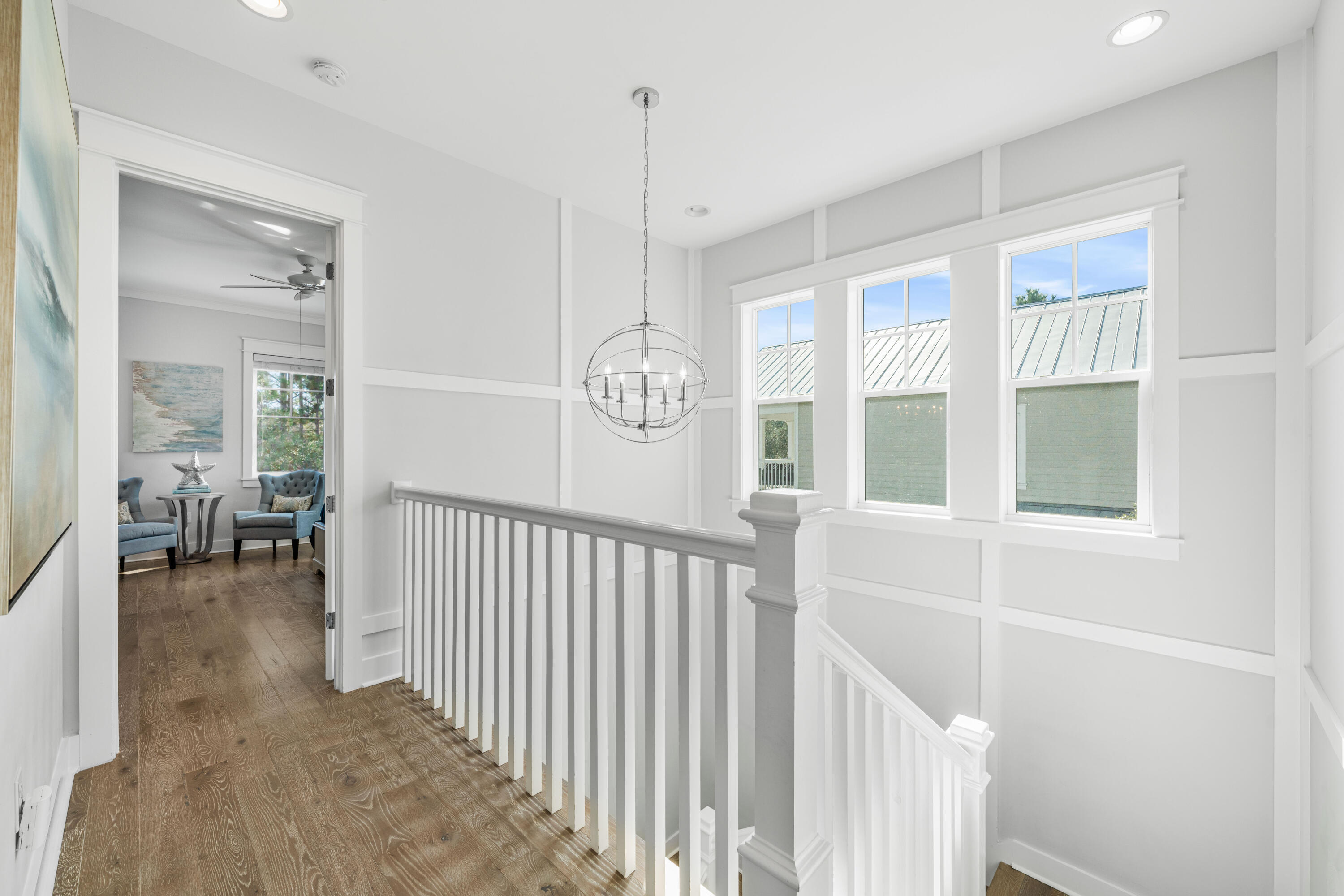 313 East Royal Fern Way Santa Rosa Beach, FL 32459 - Photo 20 of 48 a view of a hallway with windows and stairs