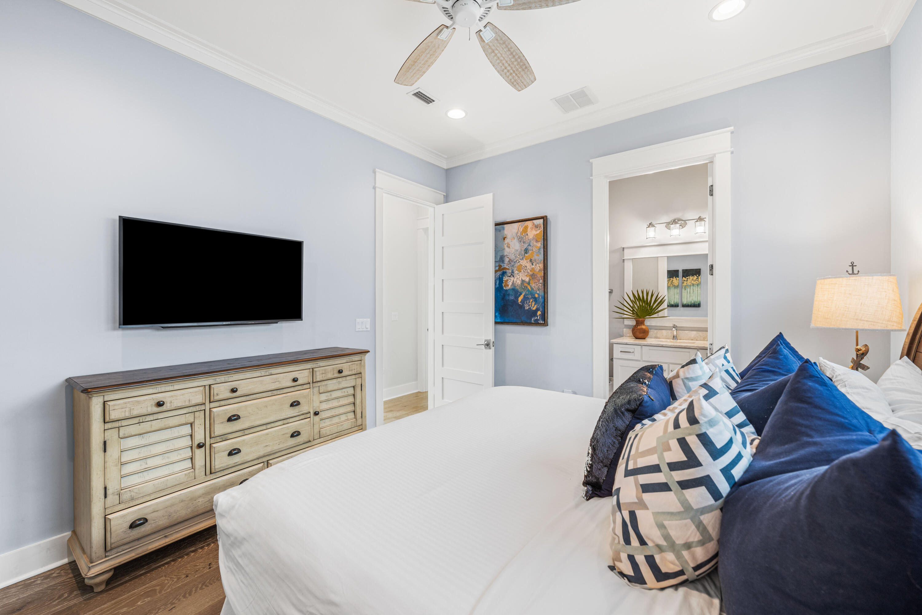 313 East Royal Fern Way Santa Rosa Beach, FL 32459 - Photo 26 of 48 a bedroom with a bed and a flat tv screen on dresser