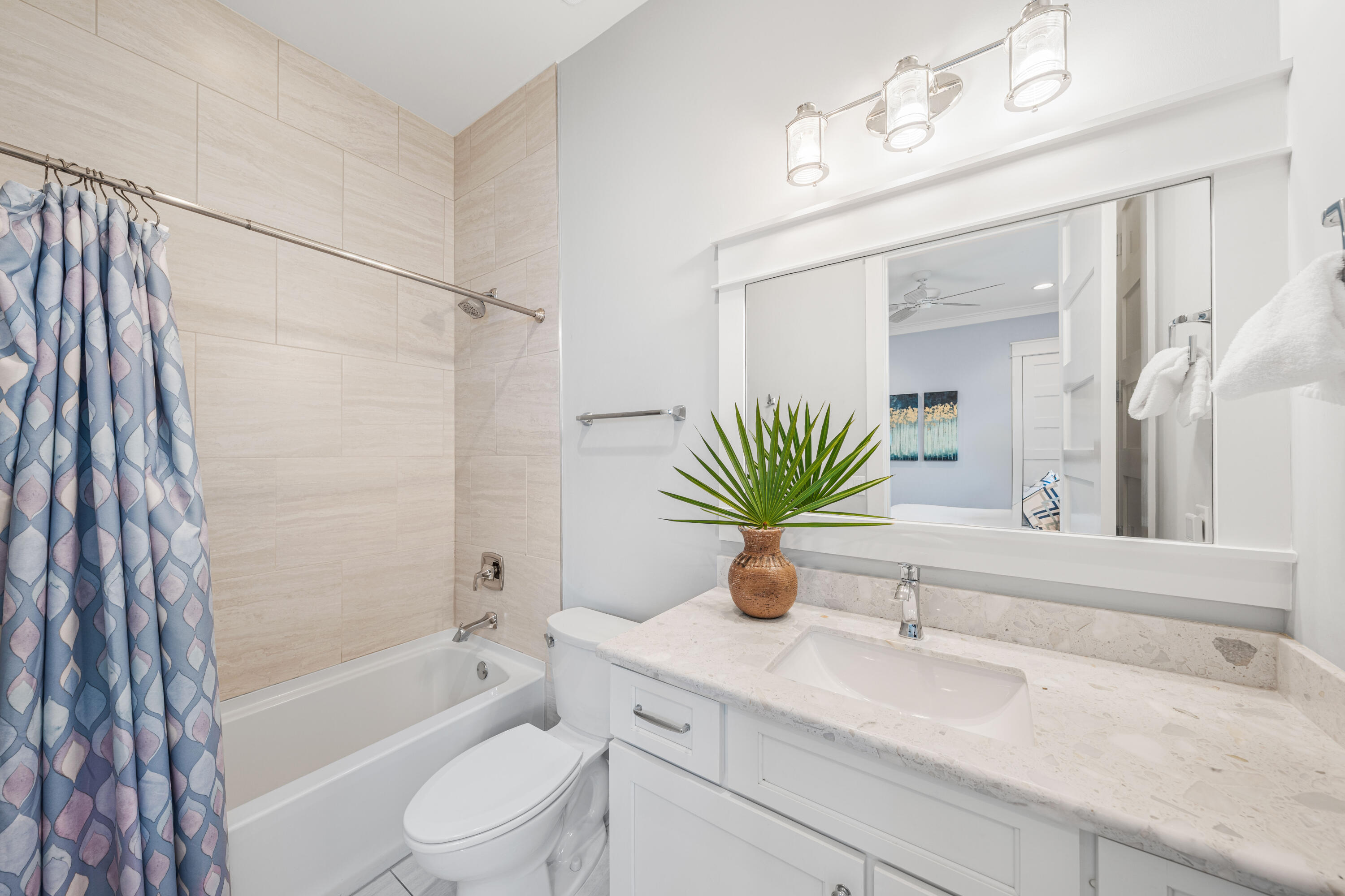 313 East Royal Fern Way Santa Rosa Beach, FL 32459 - Photo 27 of 48 a bathroom with a granite countertop sink a mirror a vanity and a bathtub