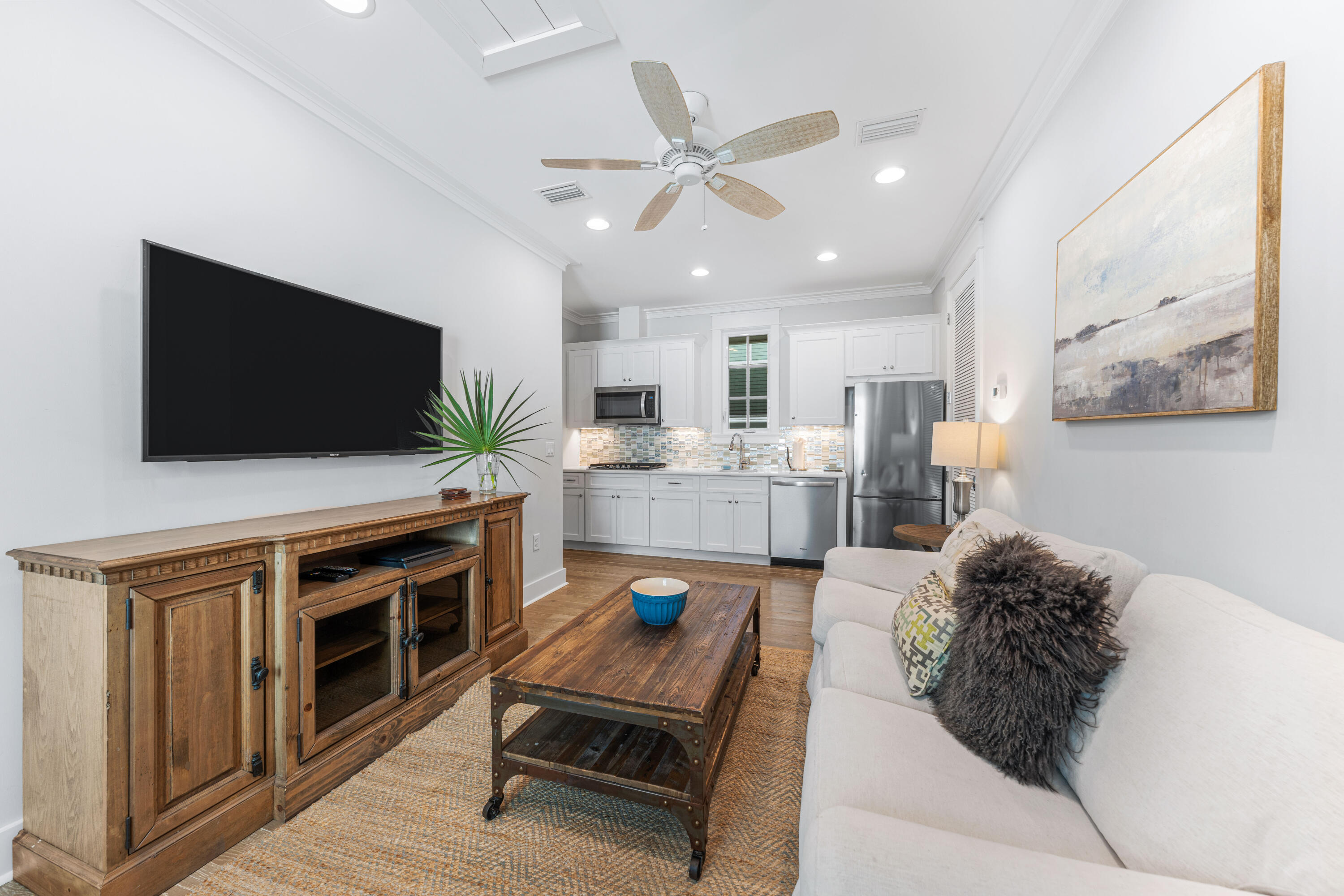 313 East Royal Fern Way Santa Rosa Beach, FL 32459 - Photo 30 of 48 a living room with furniture and a flat screen tv