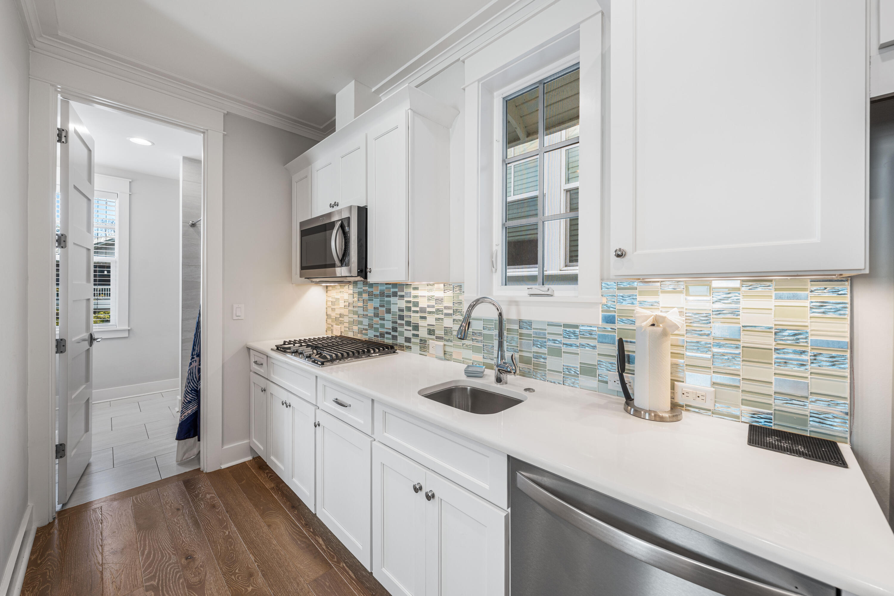 313 East Royal Fern Way Santa Rosa Beach, FL 32459 - Photo 31 of 48 a kitchen with a sink and a refrigerator