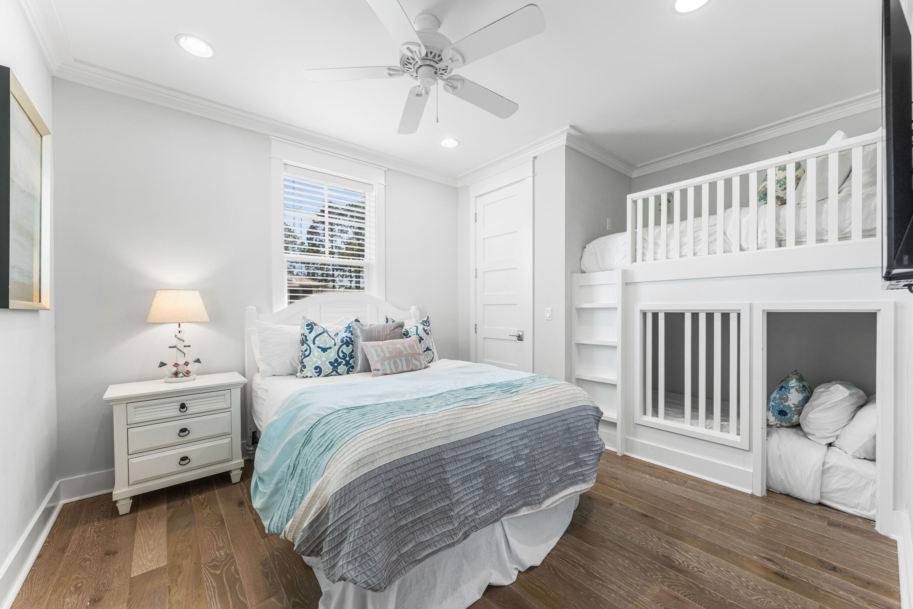 313 East Royal Fern Way Santa Rosa Beach, FL 32459 - Photo 32 of 48 a bedroom with a bed and a chandelier