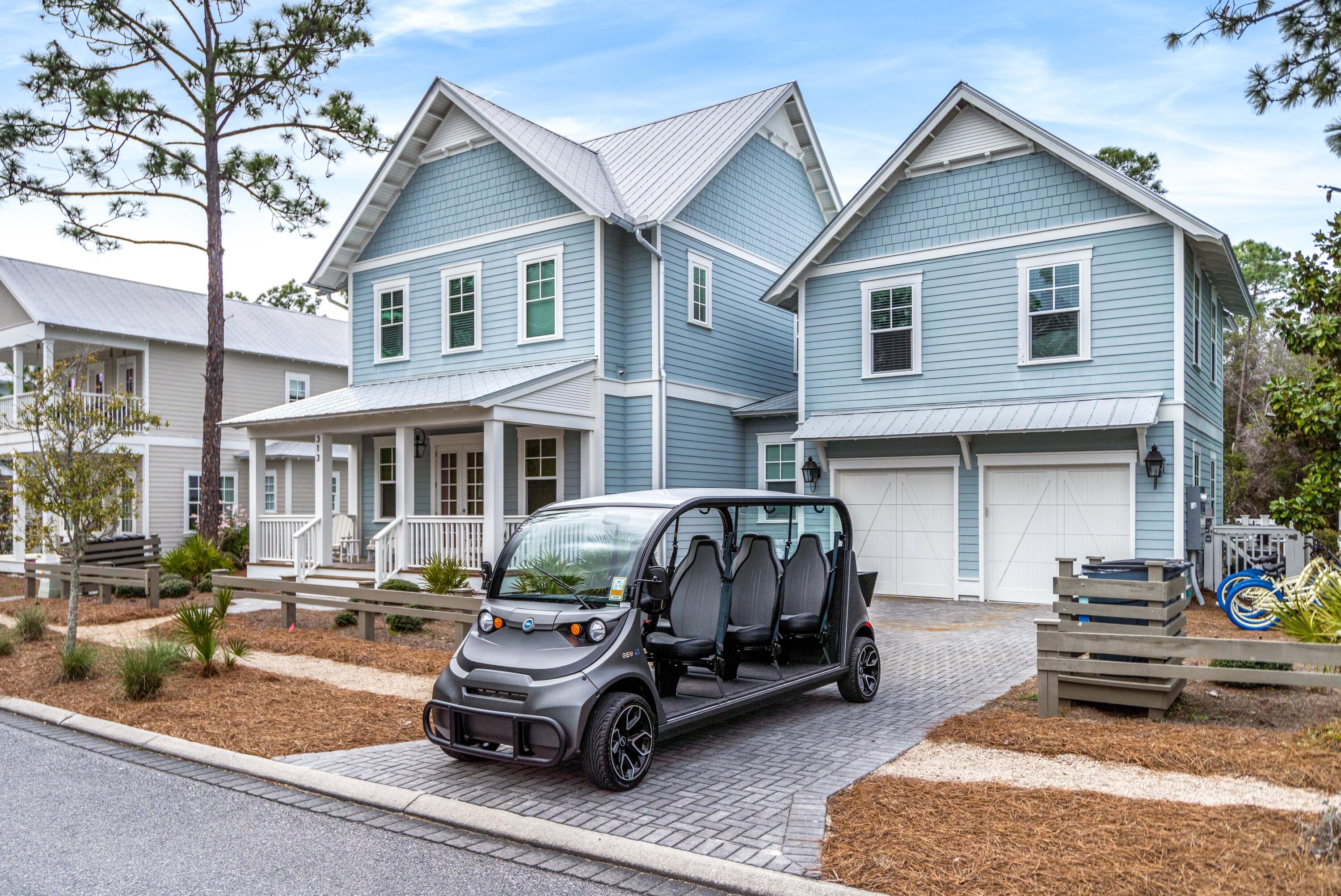 313 East Royal Fern Way Santa Rosa Beach, FL 32459 - Photo 33 of 48 a car parked in front of a white house