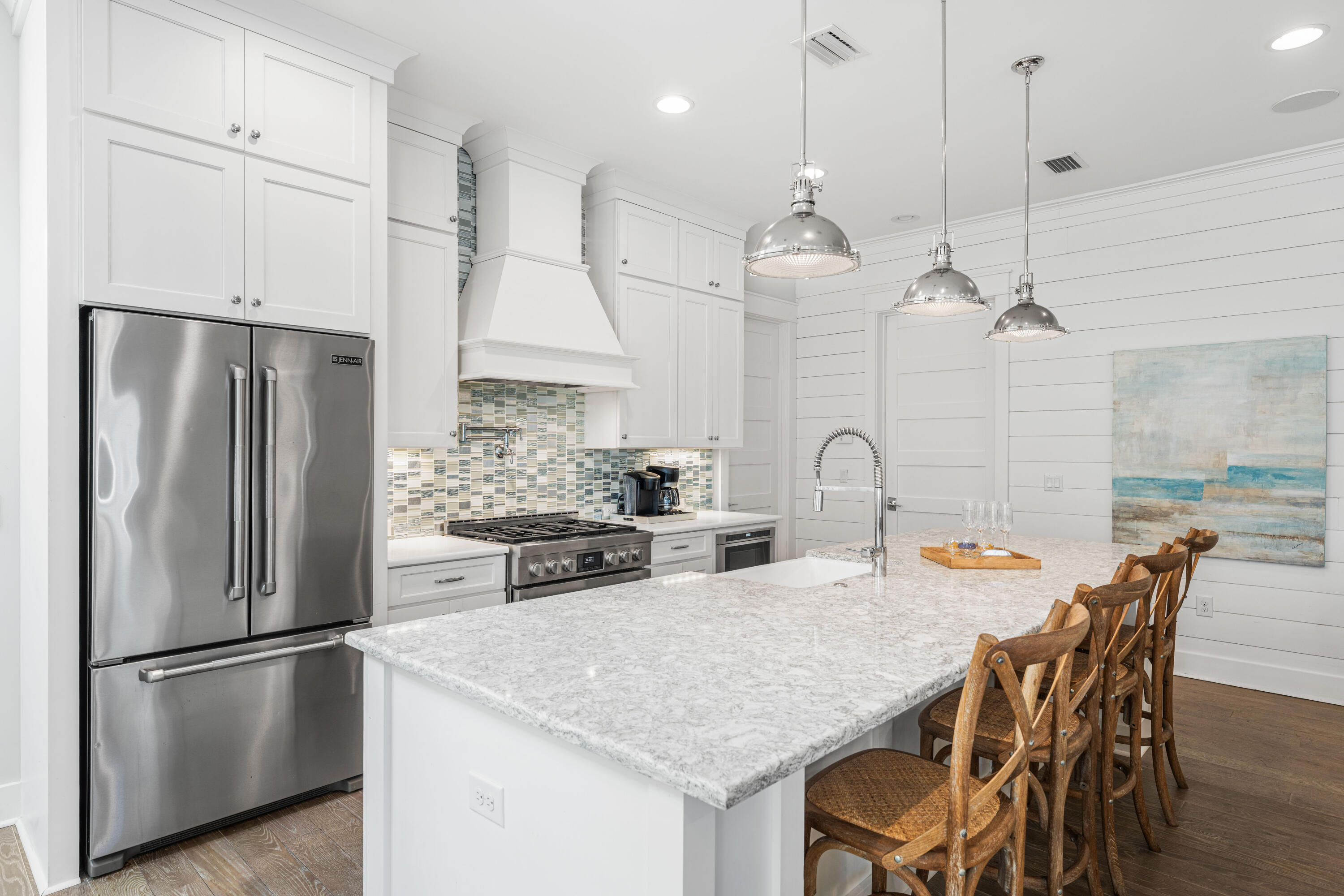 313 East Royal Fern Way Santa Rosa Beach, FL 32459 - Photo 6 of 48 a kitchen with stainless steel appliances granite countertop a kitchen island a stove a table and chairs