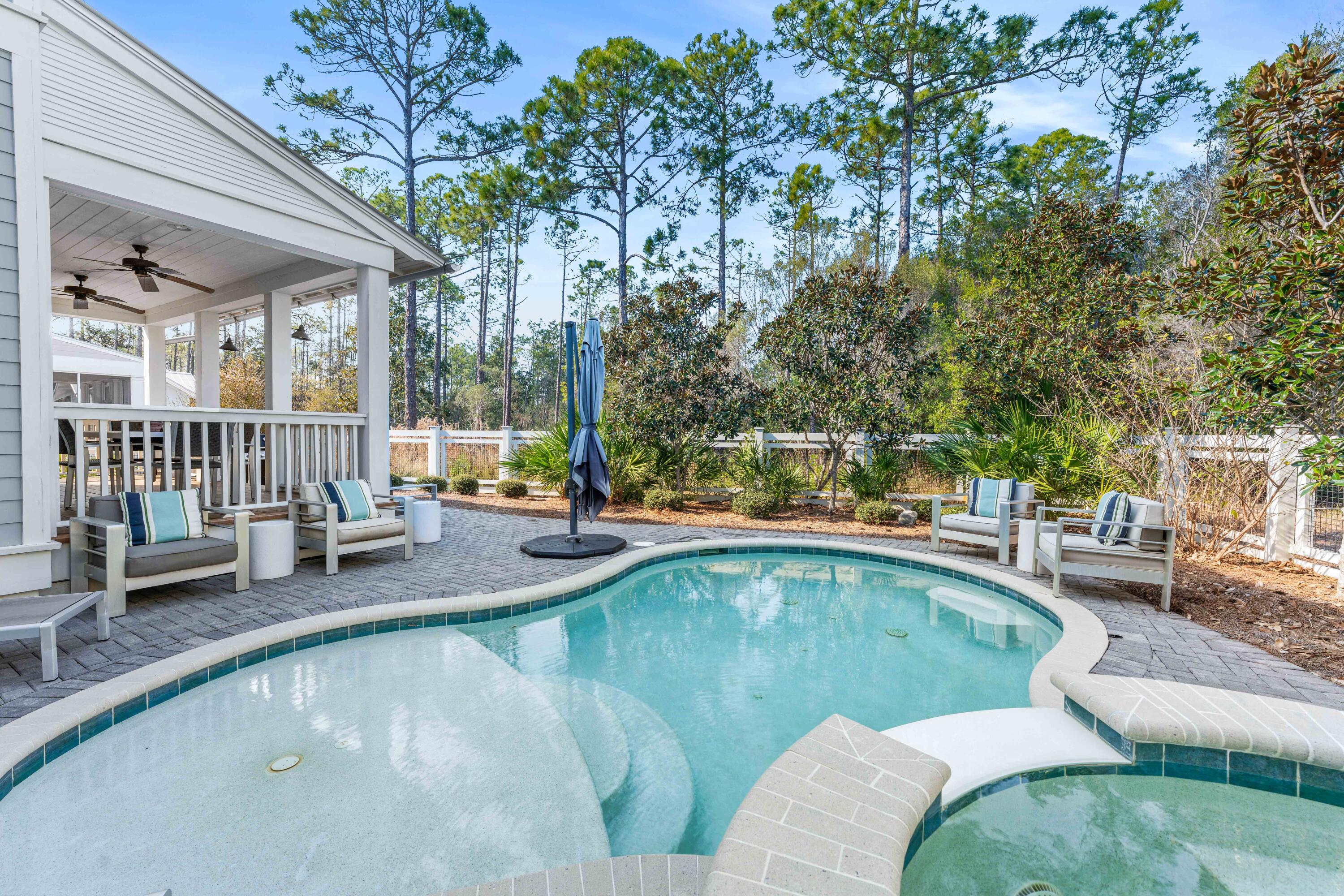 313 East Royal Fern Way Santa Rosa Beach, FL 32459 - Photo 7 of 48 a swimming pool with outdoor seating and patio